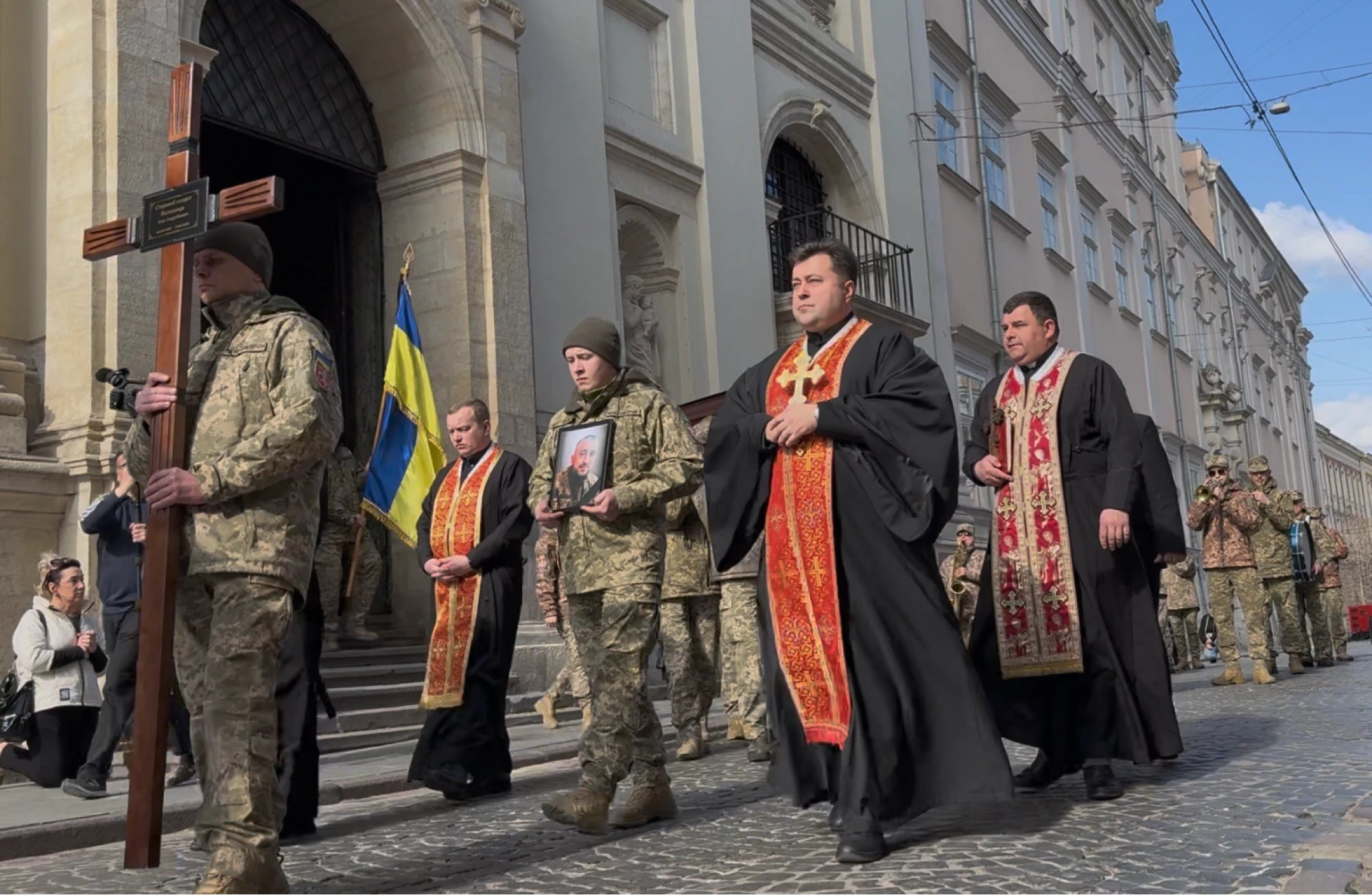 Funeral procession, Lviv. These funerals can occur once or twice a day at the same church. This one involved three fallen soldiers and their families, along with a large crowd of townspeople. A more solemn occasion I've never witnessed.